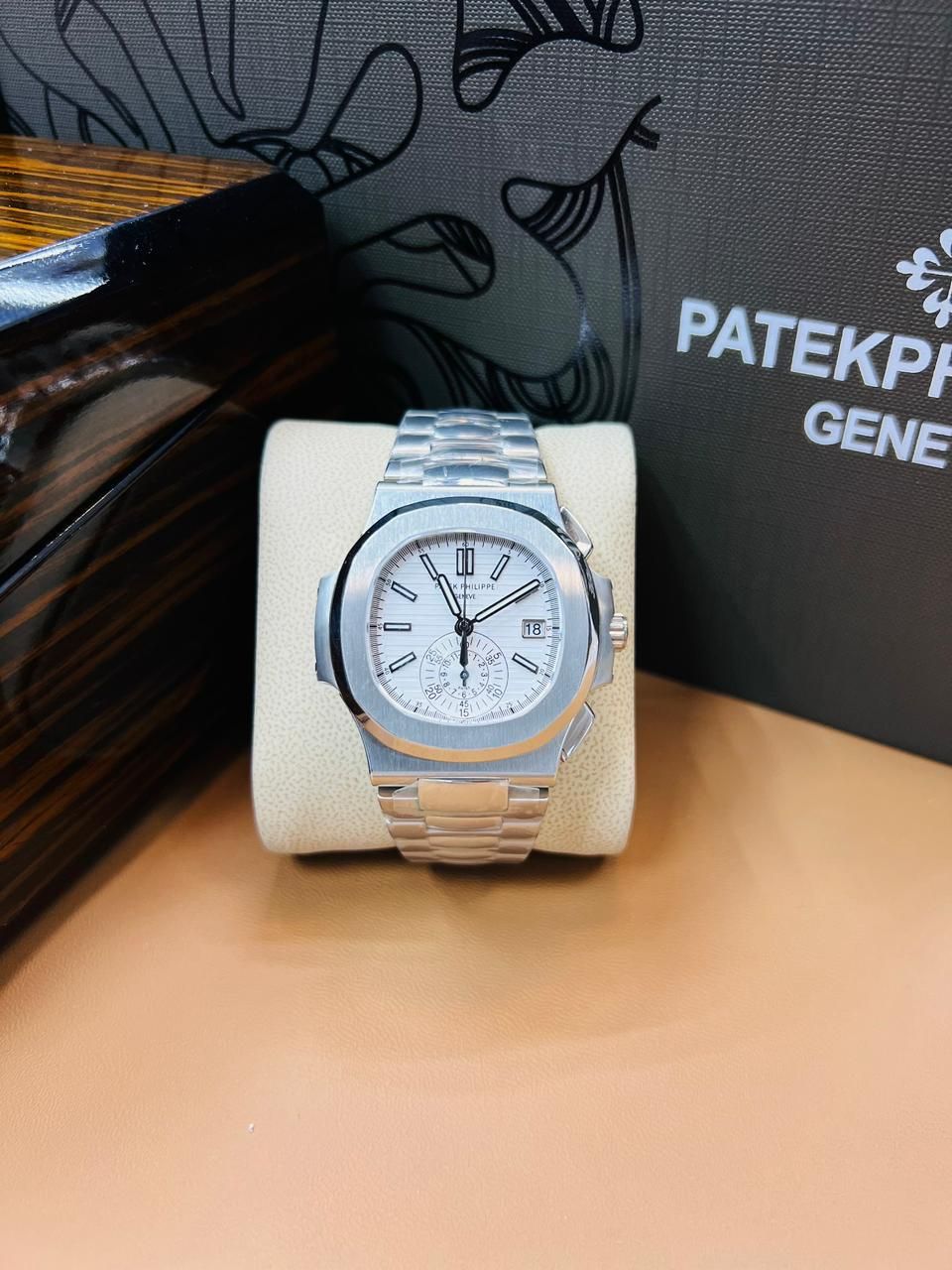 Patek Philippe Nautilus Chronograph white dial watch.
