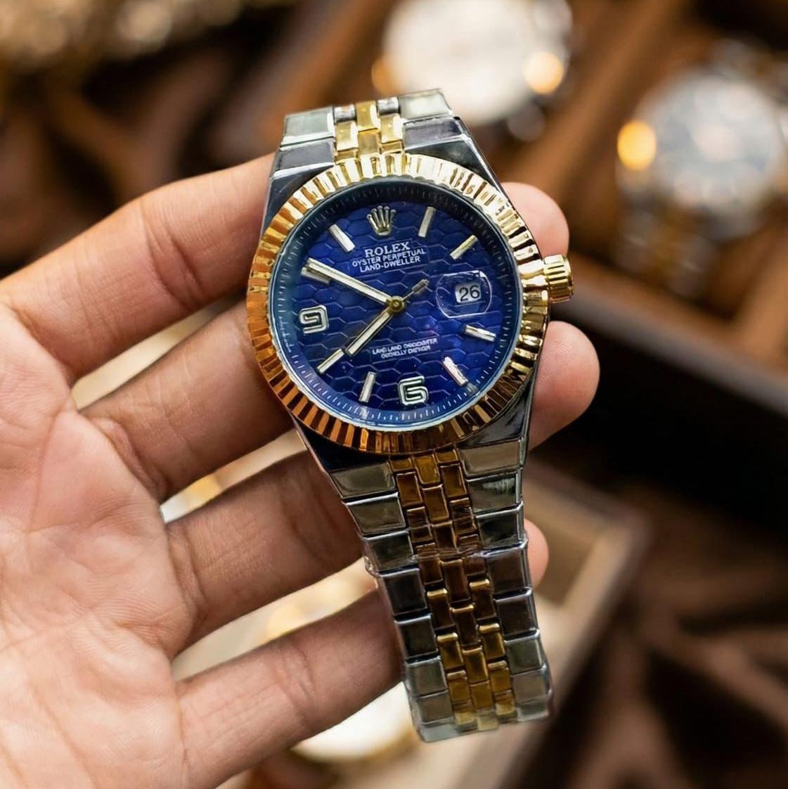 Rolex Oyster Perpetual Land-Dweller watch with a light blue dial.