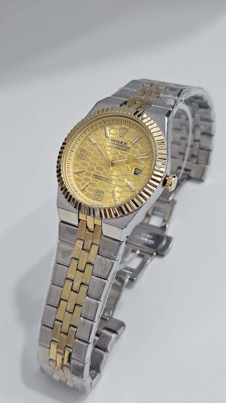 Rolex Oyster Perpetual Land-Dweller watch with a yellow honeycomb dial.