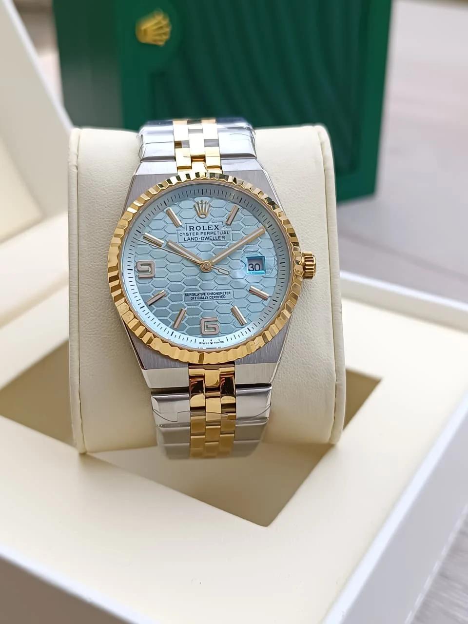 Rolex Oyster Perpetual Land-Dweller watch with a light blue dial.