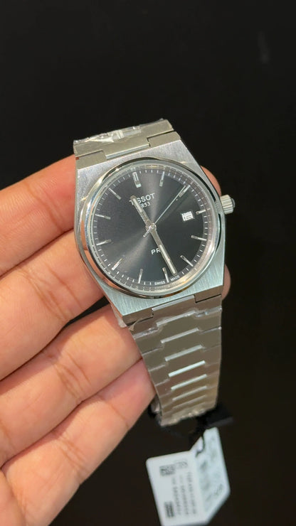 Tissot PRX steel chain with black dial.