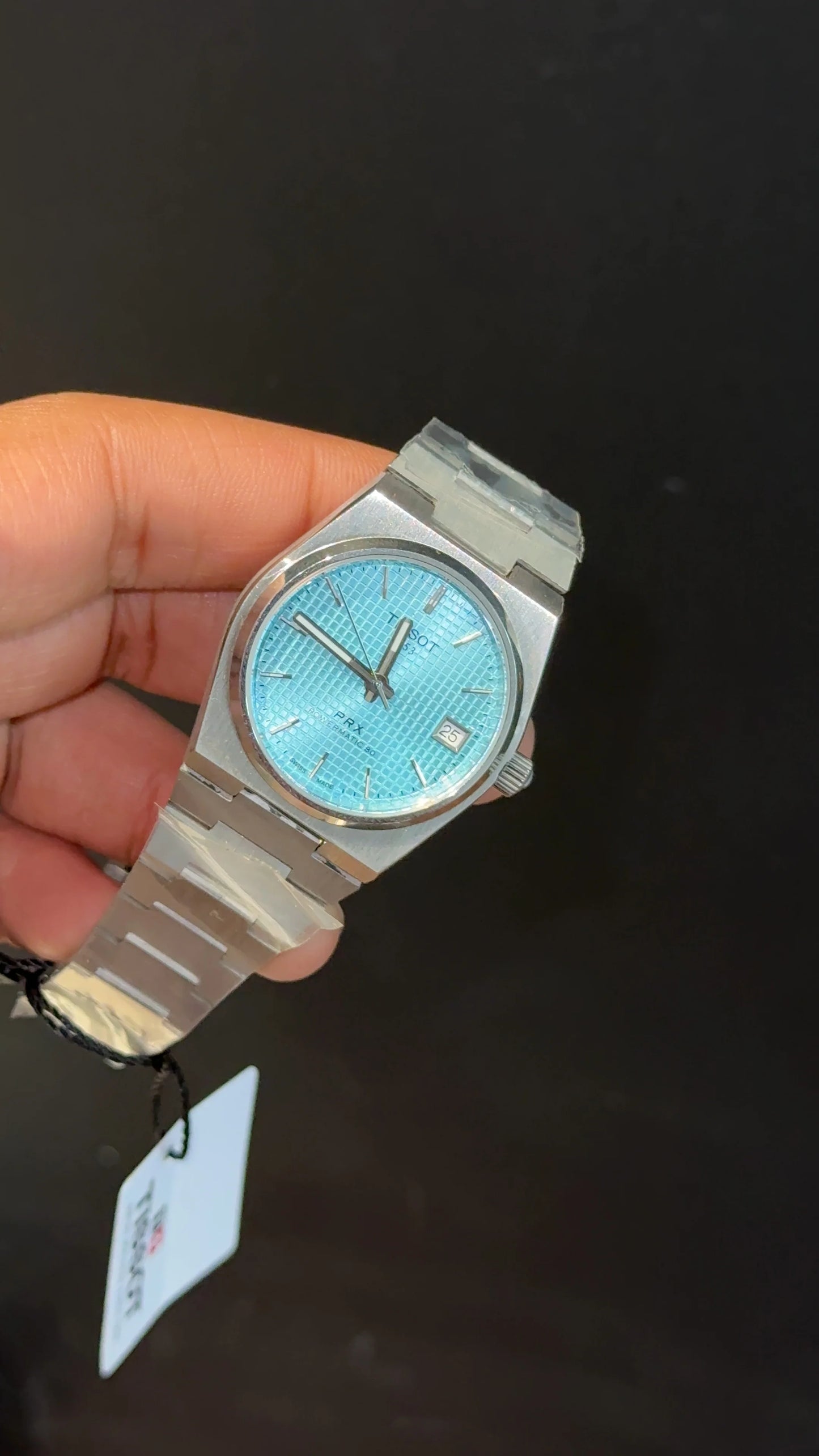 Tissot PRX silver chain with blue texture dial.