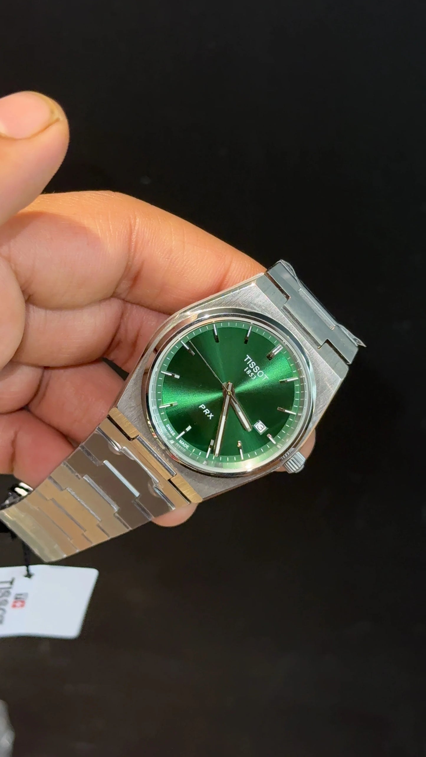 Tissot PRX steel chain with green dial.
