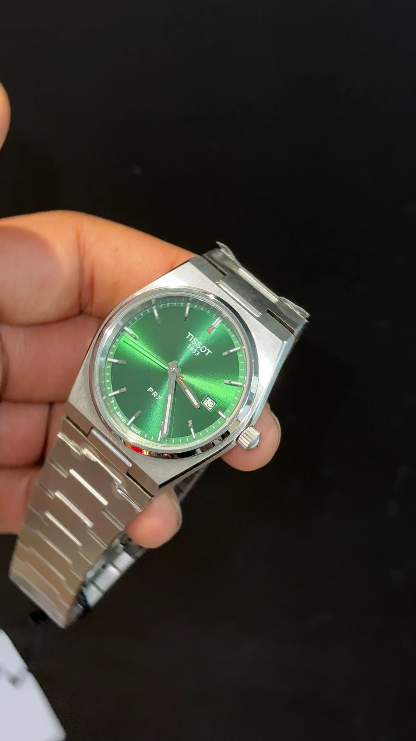 Tissot PRX steel chain with green dial.