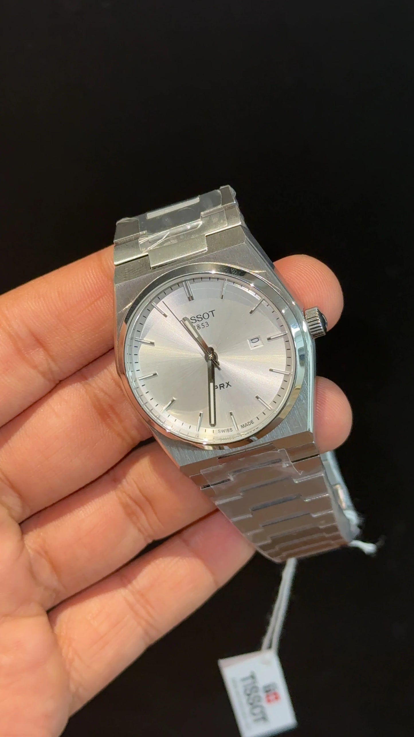Tissot PRX steel chain with white dial.