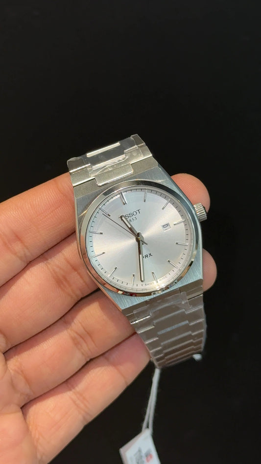 Tissot PRX steel chain with white dial.