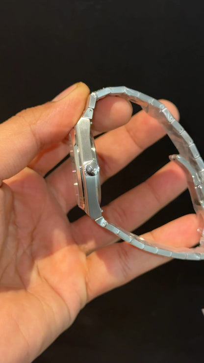 Tissot PRX steel chain with white dial.
