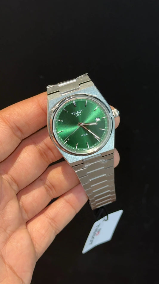 Tissot PRX steel chain with green dial.