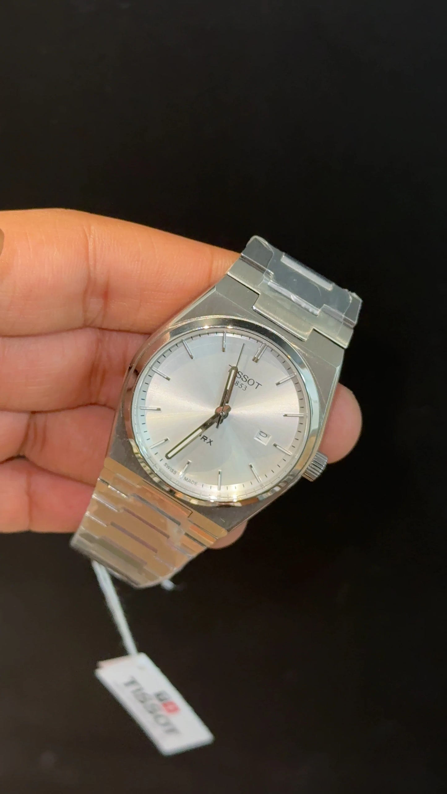 Tissot PRX steel chain with white dial.