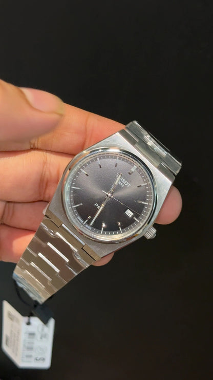 Tissot PRX steel chain with black dial.