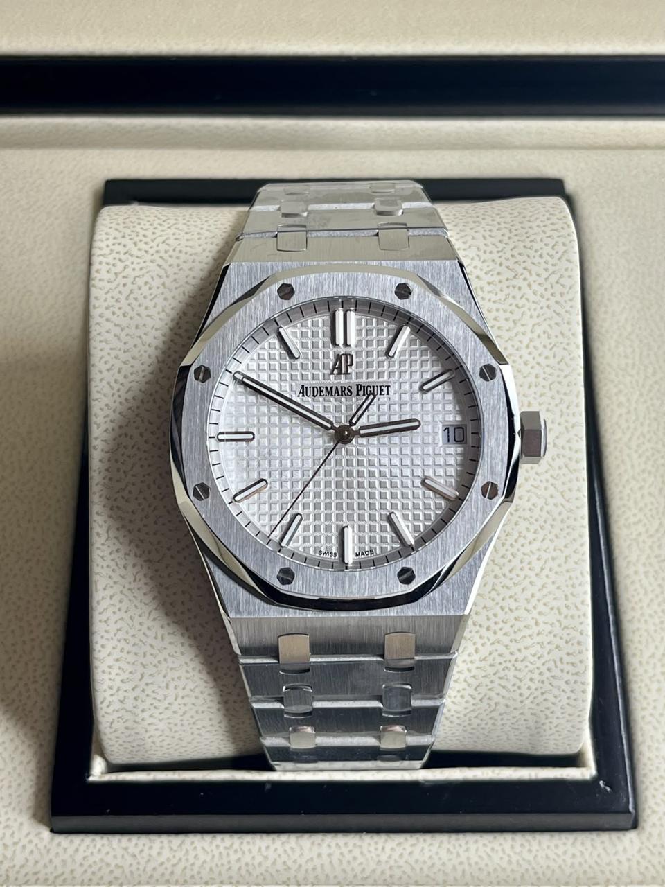 Audemars Piguet Royal Oak white dial watch.