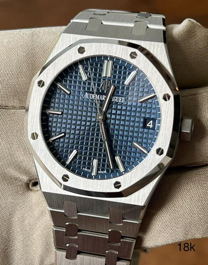 Audemars Piguet Royal Oak blue dial watch.