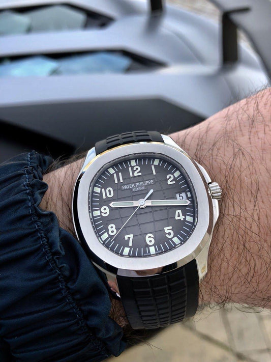 Patek Philippe Aquanaut black dial watch.