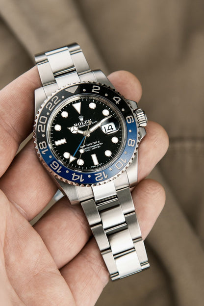 Rolex GMT-Master II "Batman" Oystersteel black dial watch.