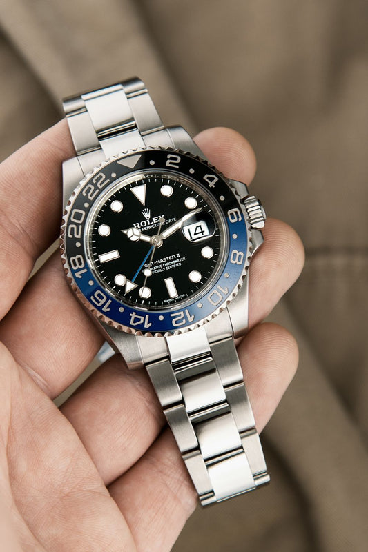 Rolex GMT-Master II "Batman" Oystersteel black dial watch.