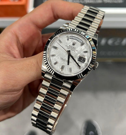 Rolex Day-Date in platinum diamond-set bezel, a meteorite dial watch.