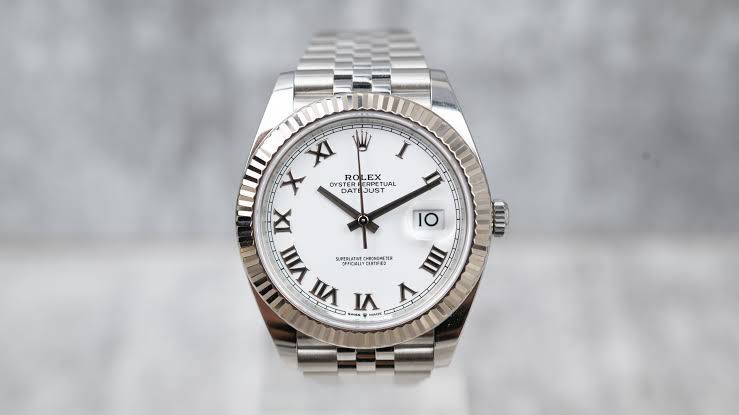 Rolex Datejust Oystersteel and white Roman dial and a Jubilee bracelet watch.