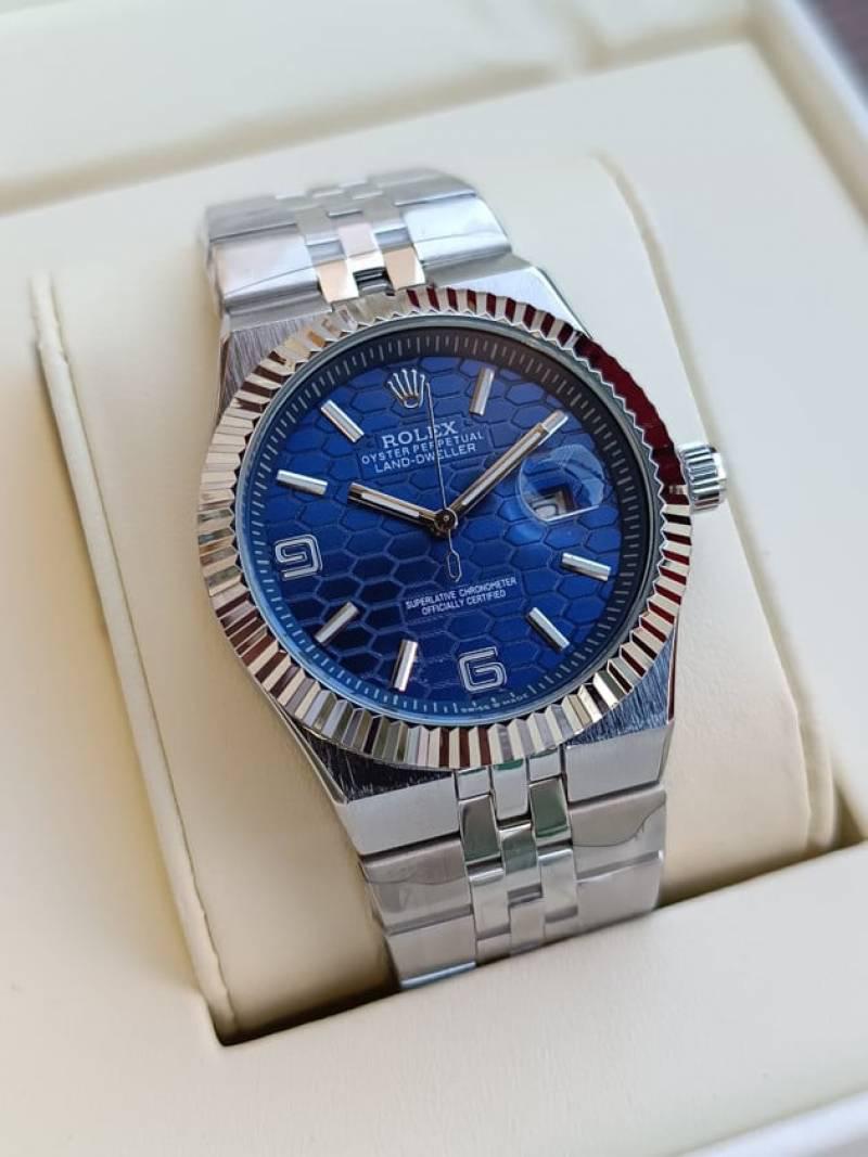 Rolex Oyster Perpetual Land-Dweller watch with a light blue dial.