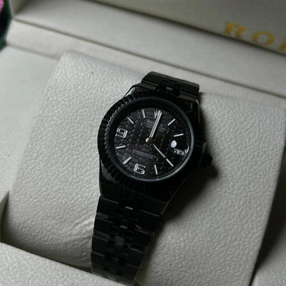 Rolex Oyster Perpetual Land-Dweller watch honeycomb-motif dial and a Jubilee bracelet.