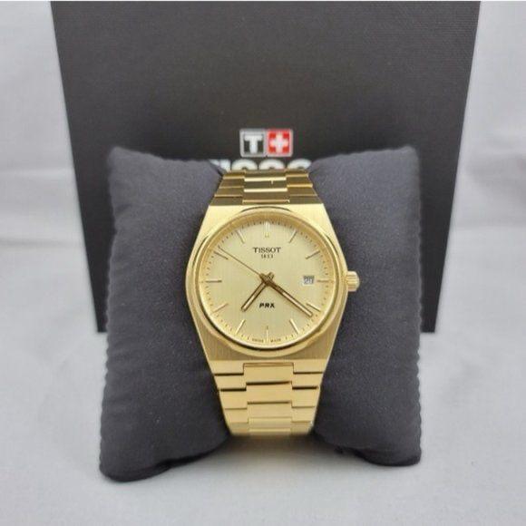 Tissot PRX Gold Watch.