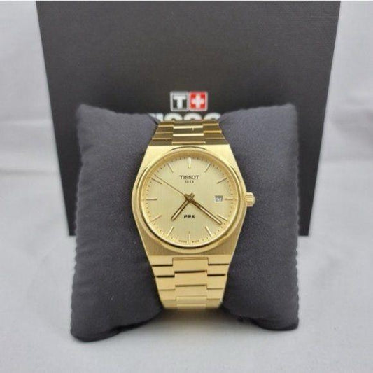 Tissot PRX Gold Watch.
