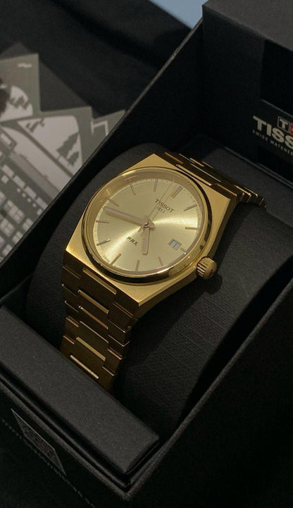 Tissot PRX Gold Watch.