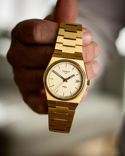 Tissot PRX Gold Watch.