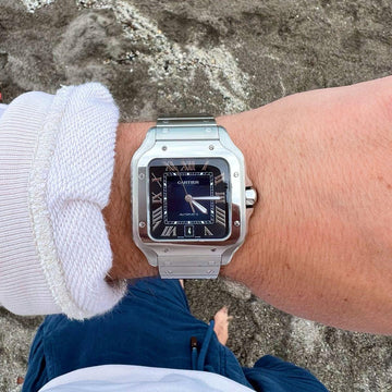 Santos de Cartier watch blue dial watch.