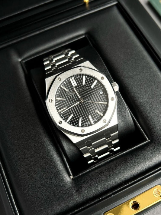 Audemars Piguet Royal Oak black dial watch.