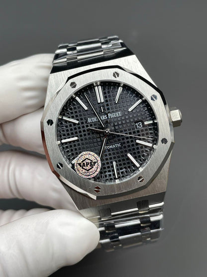 Audemars Piguet Royal Oak black dial watch.