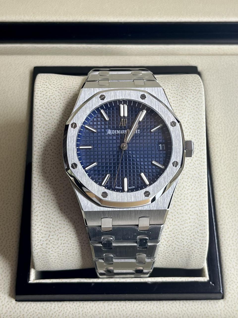 Audemars Piguet Royal Oak blue dial watch.