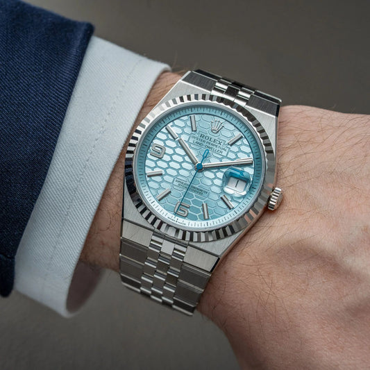 Rolex Oyster Perpetual platinum with an ice blue honeycomb dial.