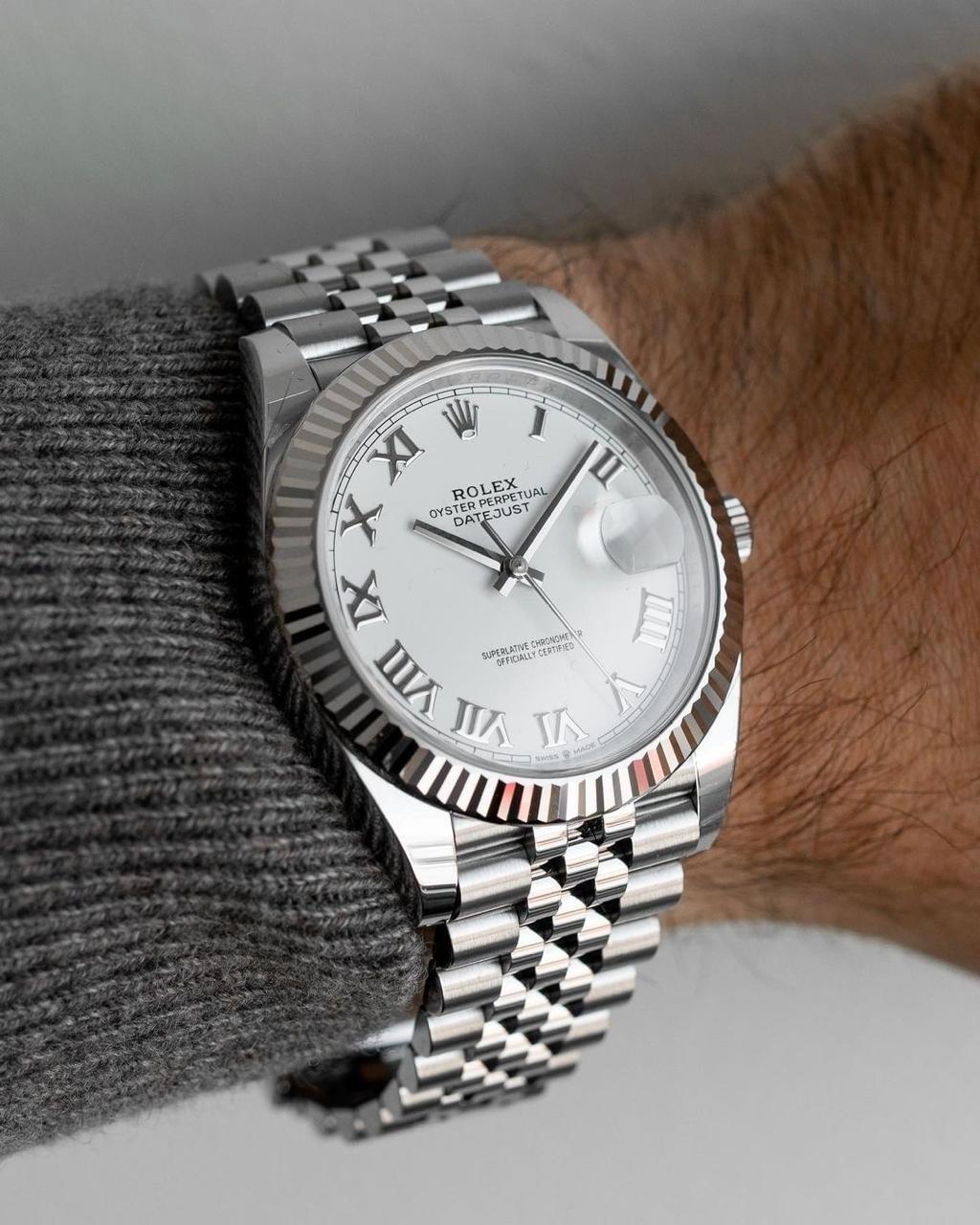 Rolex Datejust Oystersteel and white Roman dial and a Jubilee bracelet watch.