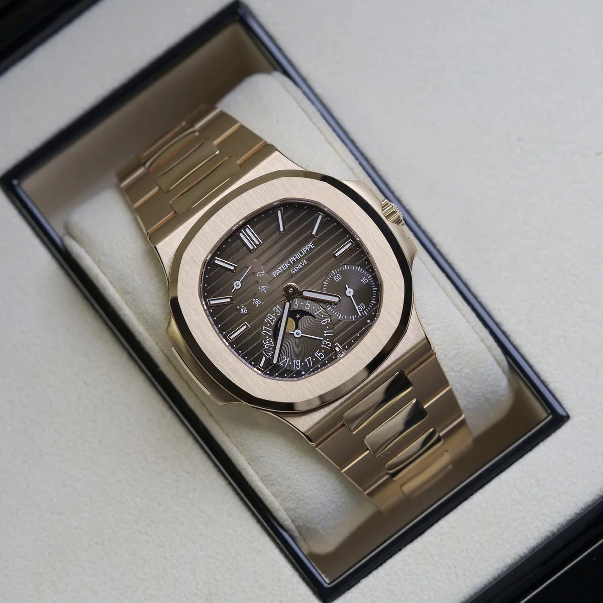 Patek Philippe Nautilus rose gold with a brown sunburst dial watch.