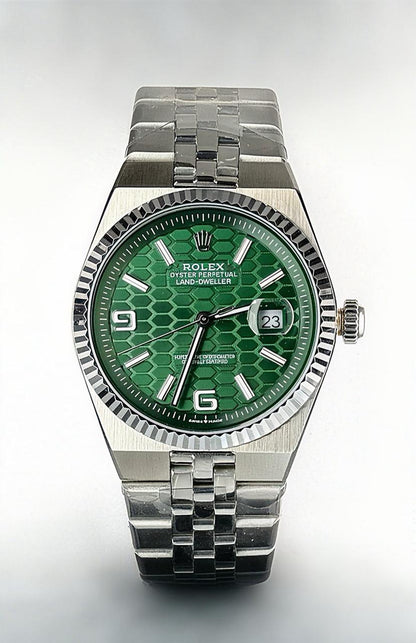 Rolex Oyster Perpetual Land-Dweller with a green dial watch.