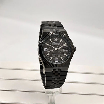 Rolex Oyster Perpetual Land-Dweller watch honeycomb-motif dial and a Jubilee bracelet.