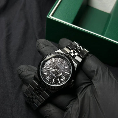 Rolex Oyster Perpetual Land-Dweller watch honeycomb-motif dial and a Jubilee bracelet.